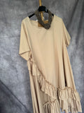 Vestido asimétrico volantes beige