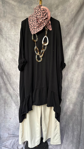 Camiseta larga asimétrica con volantes