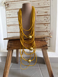 Collar largo caucho mostaza