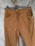 Pantalón jogger Camel brillos