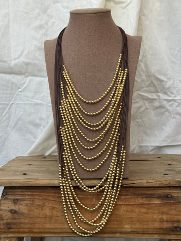 Collar multi con bolas doradas