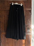 Pantalón palazzo cropped negro