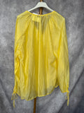 Blusa volantes amarilla