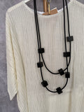 Conjunto plisado
