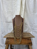 Collar multi con bolas doradas
