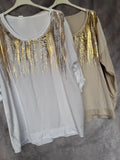Camiseta beige con dorado