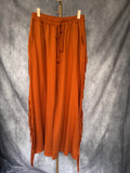 Pantalón flecos naranja