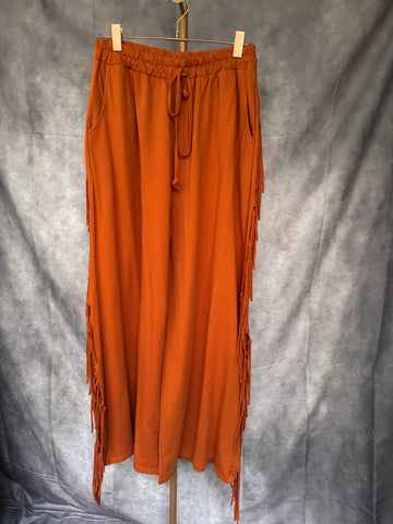 Pantalón flecos naranja