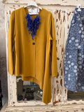 Chaqueta asimétrica mostaza