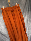 Pantalón flecos naranja