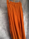 Pantalón flecos naranja