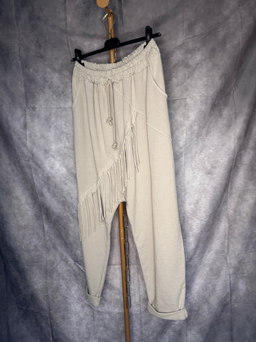 Pantalón baggy flecos claro