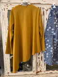 Chaqueta asimétrica mostaza