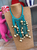 Collar caucho bolas turquesa